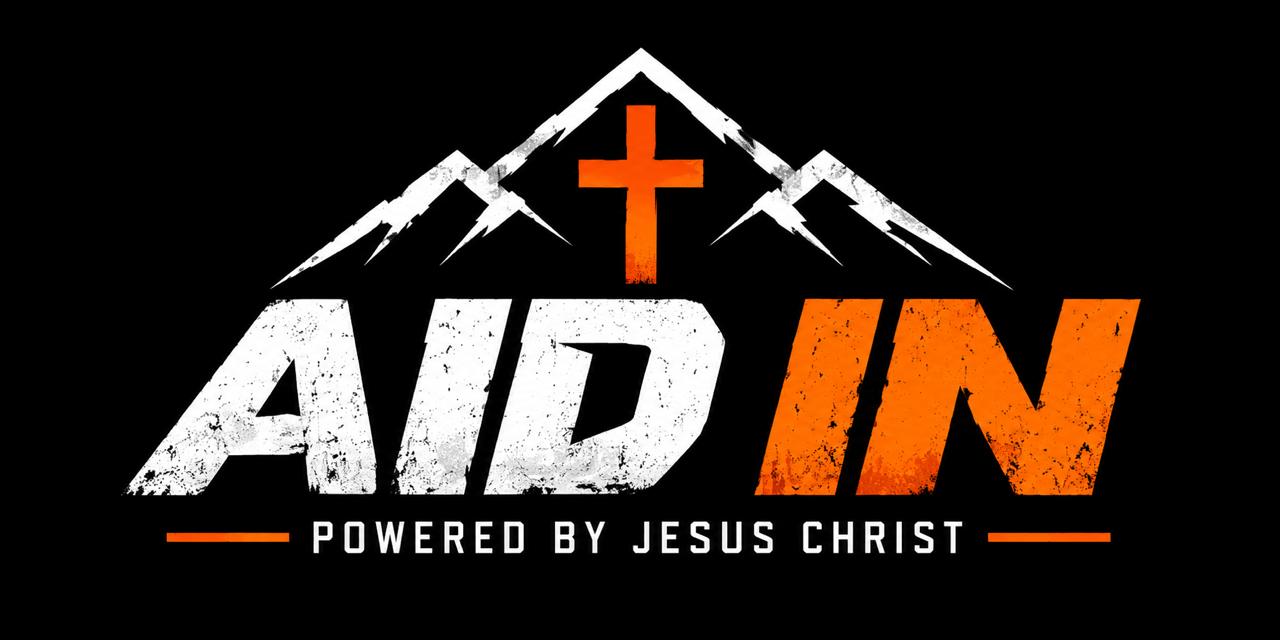 AID IN. Powered by Jesus Christ. The Aid In Crew logo.