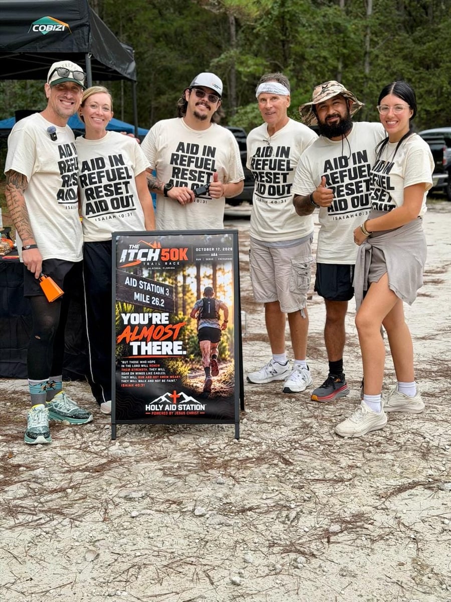 The Aid In Crew in AID IN REFUEL RESET AID OUT shirts at The Itch 50K Aid Station 3 Mile 26.2.
